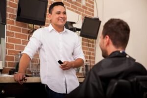 A Barber Chatting to a Customer